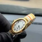 45-degree angle view of the Cartier Baignoire Small Model sapphire yellow gold women's watch.