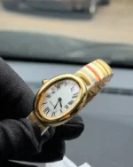 45-degree angle view of the Cartier Baignoire Small Model sapphire yellow gold women's watch.