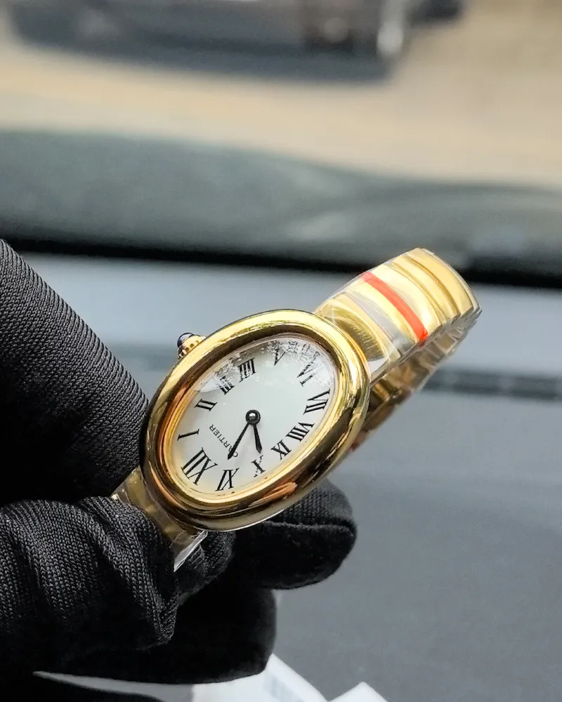 45-degree angle view of the Cartier Baignoire Small Model sapphire yellow gold women's watch.