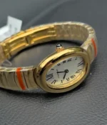 Side view of the Cartier Baignoire Small Model sapphire yellow gold women's watch, showcasing the satin finish on the case.