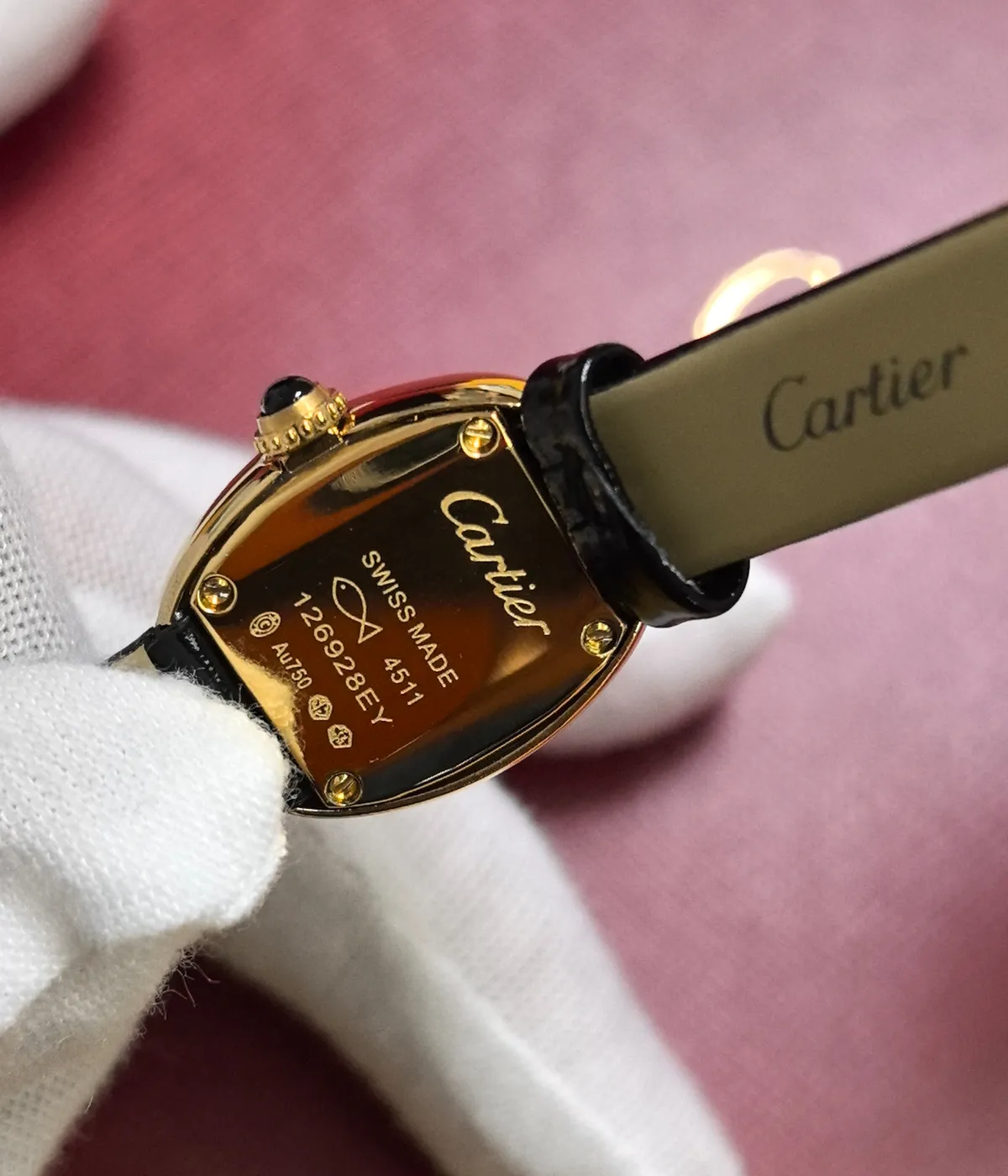 Detailed close-up of the caseback of the Cartier Baignoire WGBA0017 Small Model Sapphire Yellow Gold Women's Watch.