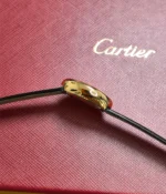 Side view of the Cartier Baignoire WGBA0017 Small Model Sapphire Yellow Gold Women's Watch, showcasing its satin finish.