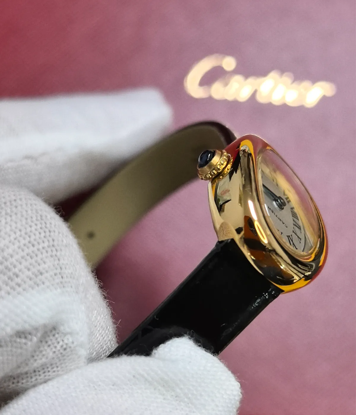 Close-up of the strap connection on the Cartier Baignoire WGBA0017 Small Model Sapphire Yellow Gold Women's Watch.