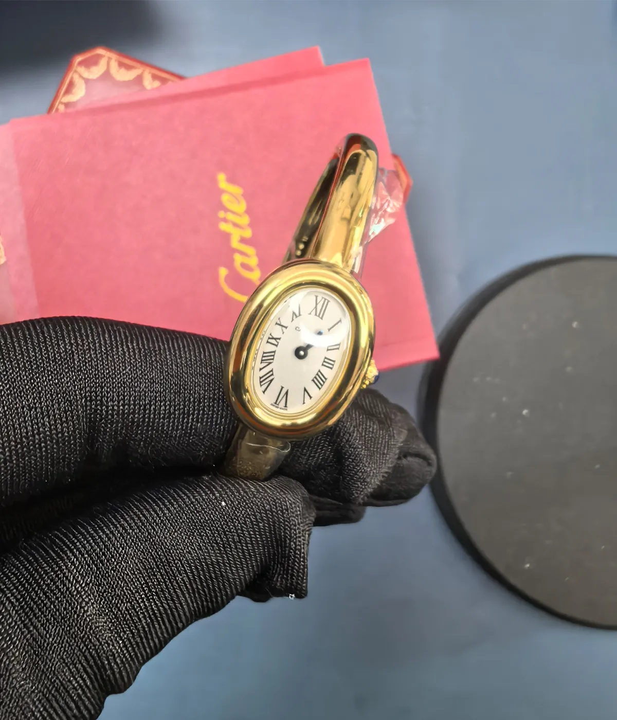 Close-up of the front dial material of the Cartier Baignoire WGBA0019 White Dial Gold Bracelet Women's Watch.