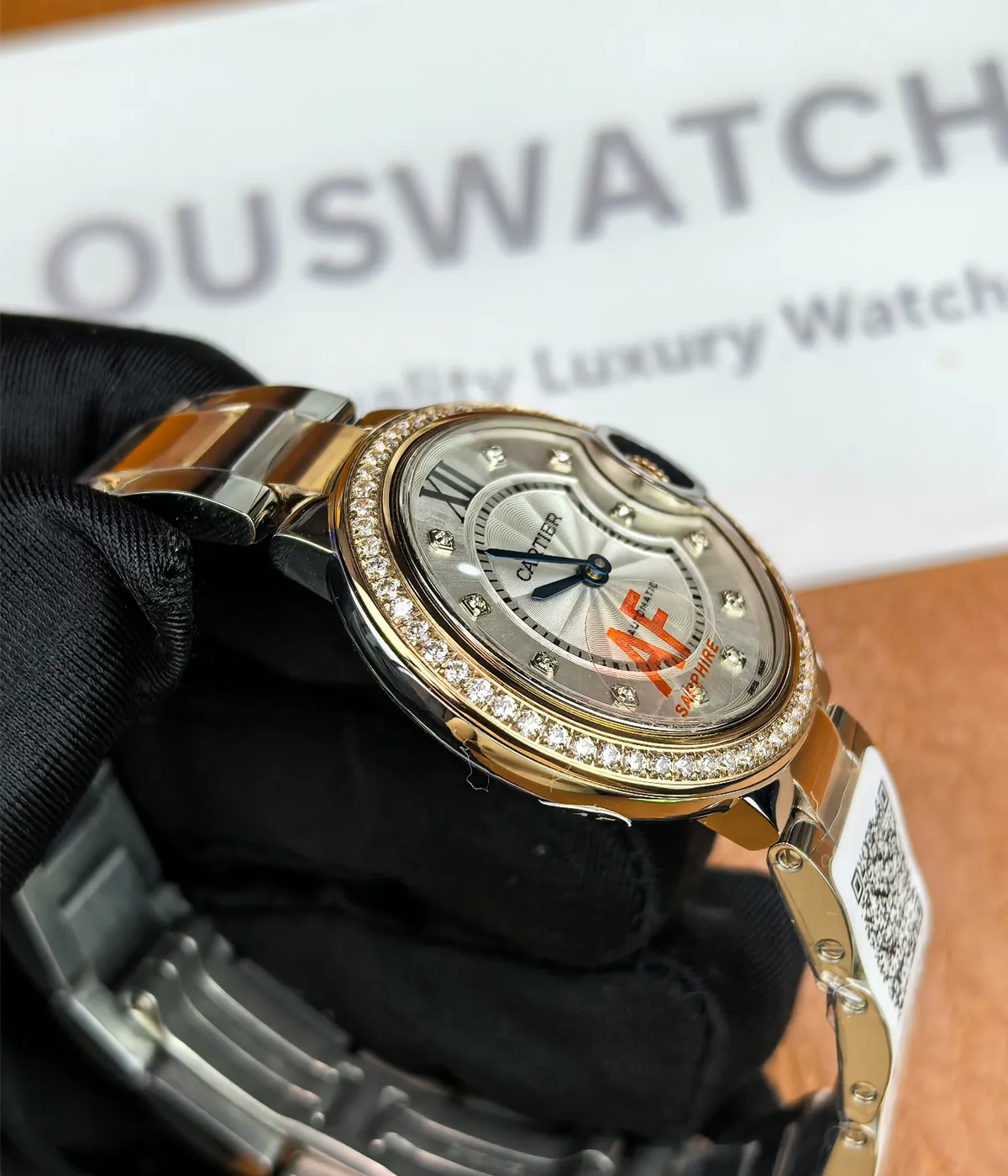 Side view of the Cartier Ballon Bleu De Two Tone Rose Gold and Steel 36MM Diamond Set watch, showcasing the satin finish on the case.