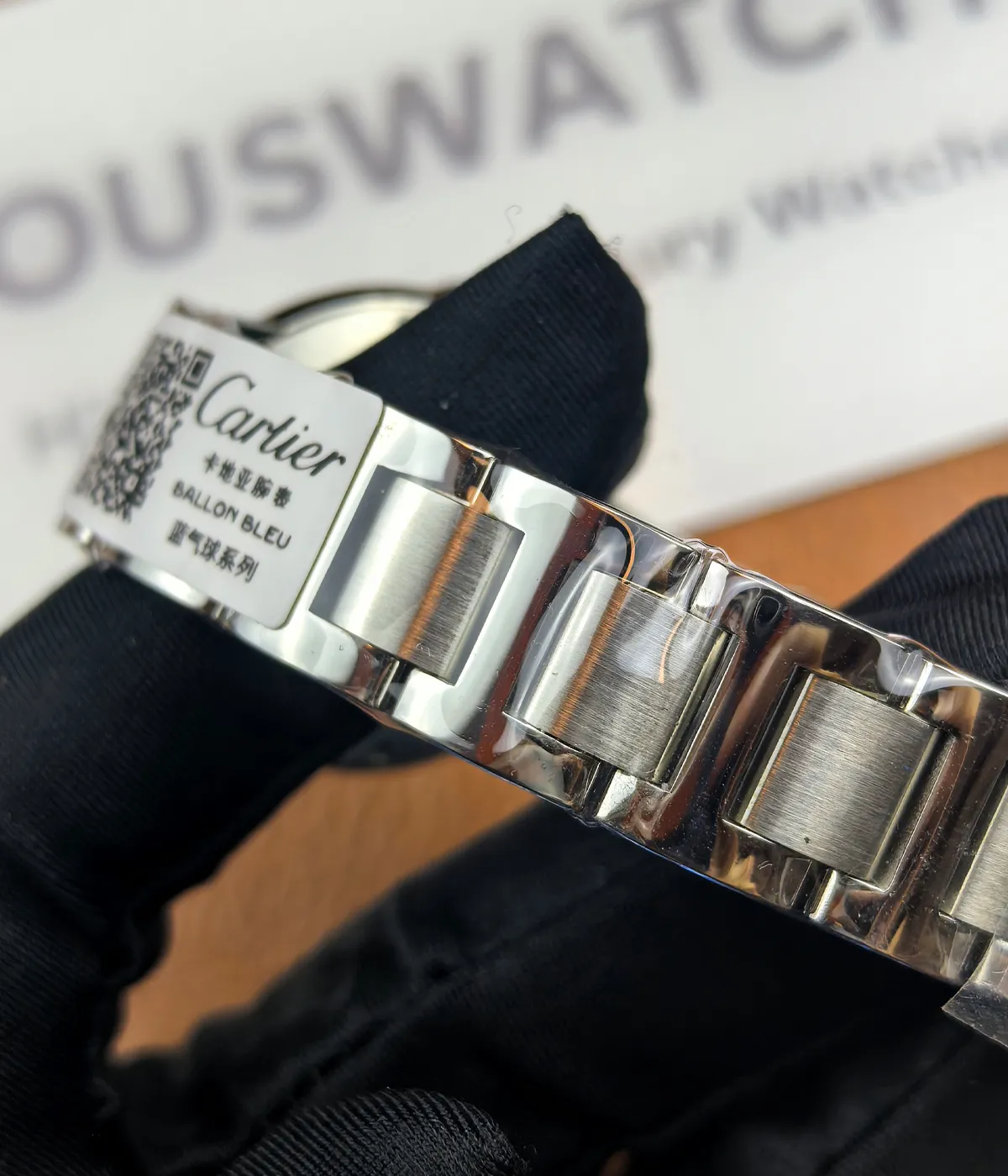 Close-up of the bracelet craftsmanship on the Cartier Ballon Bleu de White Dial with diamond accents women's watch.