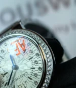 Close-up of the diamond setting on the Cartier Ballon Bleu de White Dial with diamond accents women's watch.