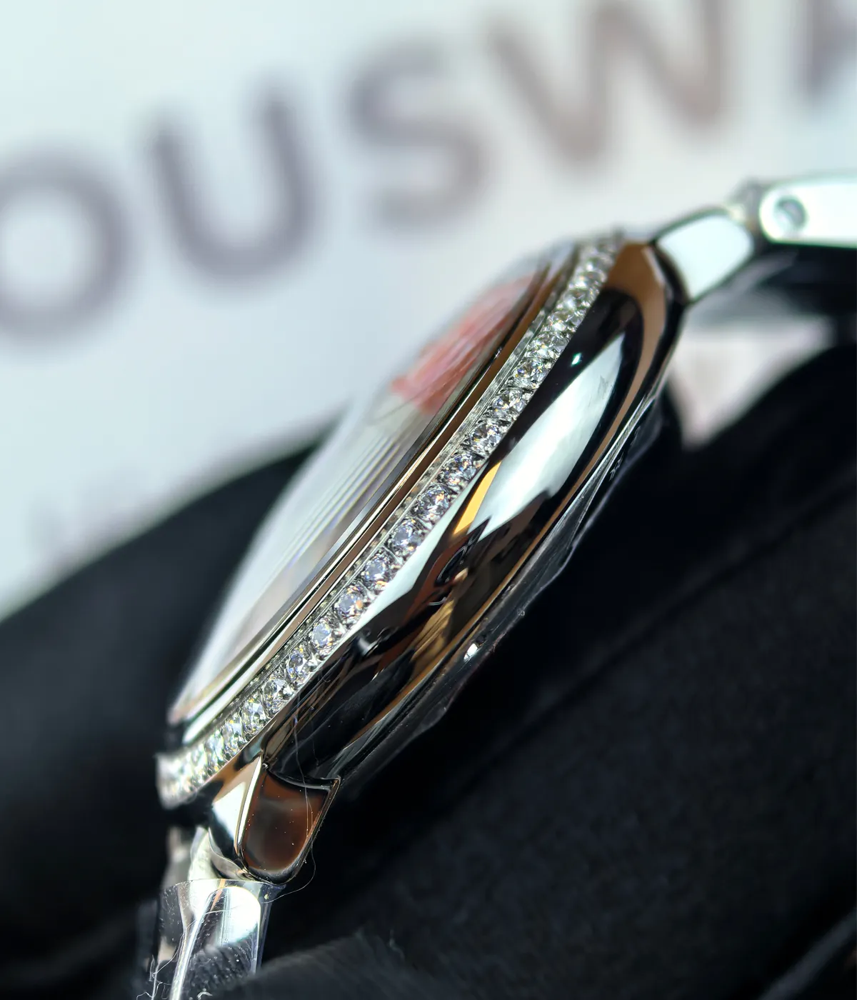 Side view of the Cartier Ballon Bleu de White Dial with diamond accents women's watch, showcasing the satin finish on the case.