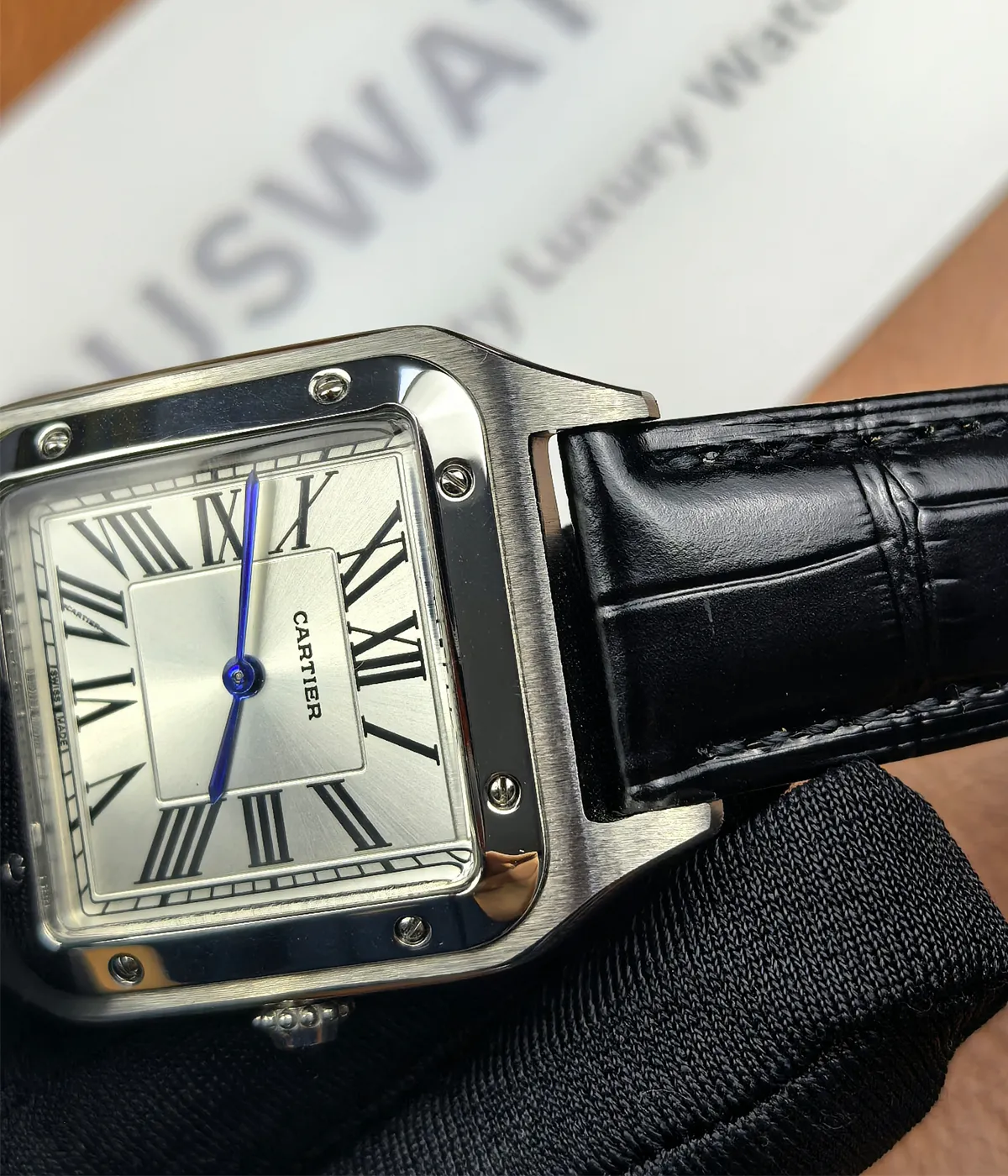 Close-up of the lugs on the Cartier WSSA0023 Santos Dumont Small Sapphire Crocodile Leather Watch Strap.