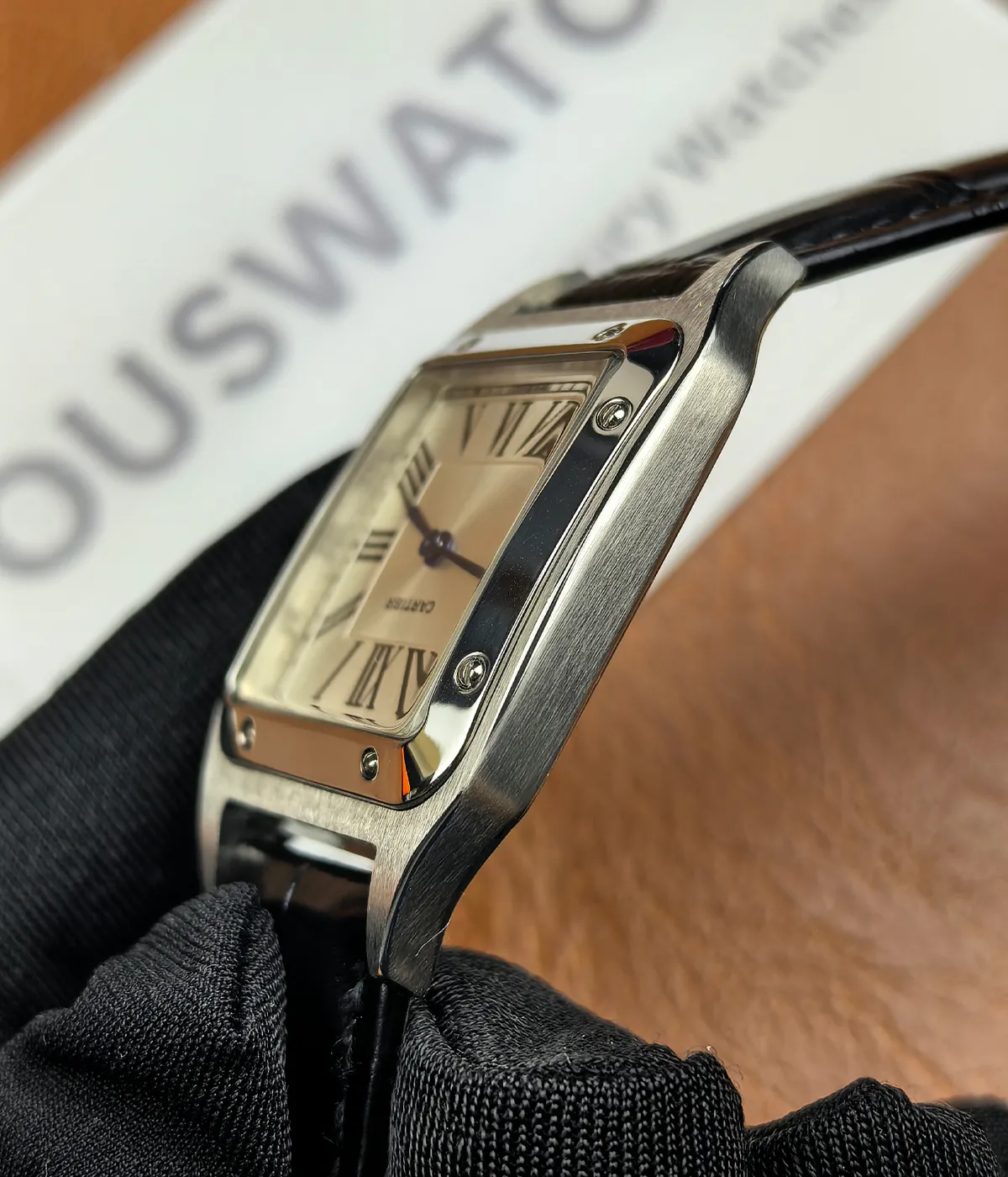 Side view of the Cartier WSSA0023 Santos Dumont Small watch, showcasing the satin finish on the case.