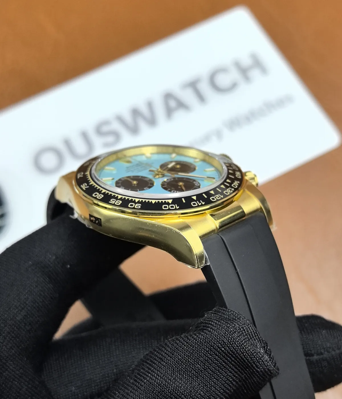 Side view of the Golden Rolex Daytona 126518LN-0014, showcasing the satin finish on the case.