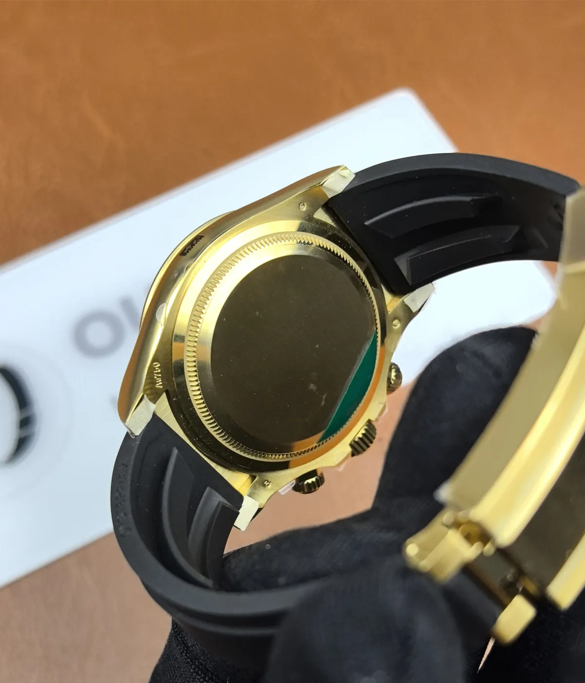 View of the caseback of the Golden Rolex Daytona 126518LN-0014 with a blue and gold dial.