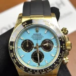 Front view of the Golden Rolex Daytona 126518LN-0014 with a blue dial, gold dial, and Oysterflex bracelet.