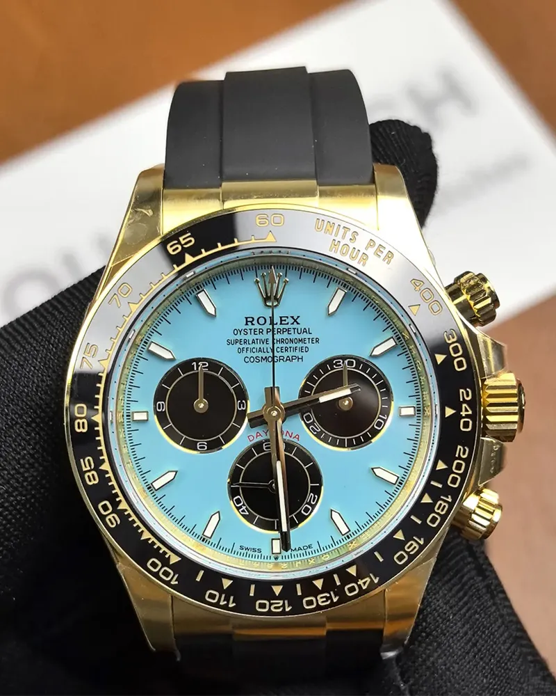 Front view of the Golden Rolex Daytona 126518LN-0014 with a blue dial, gold dial, and Oysterflex bracelet.