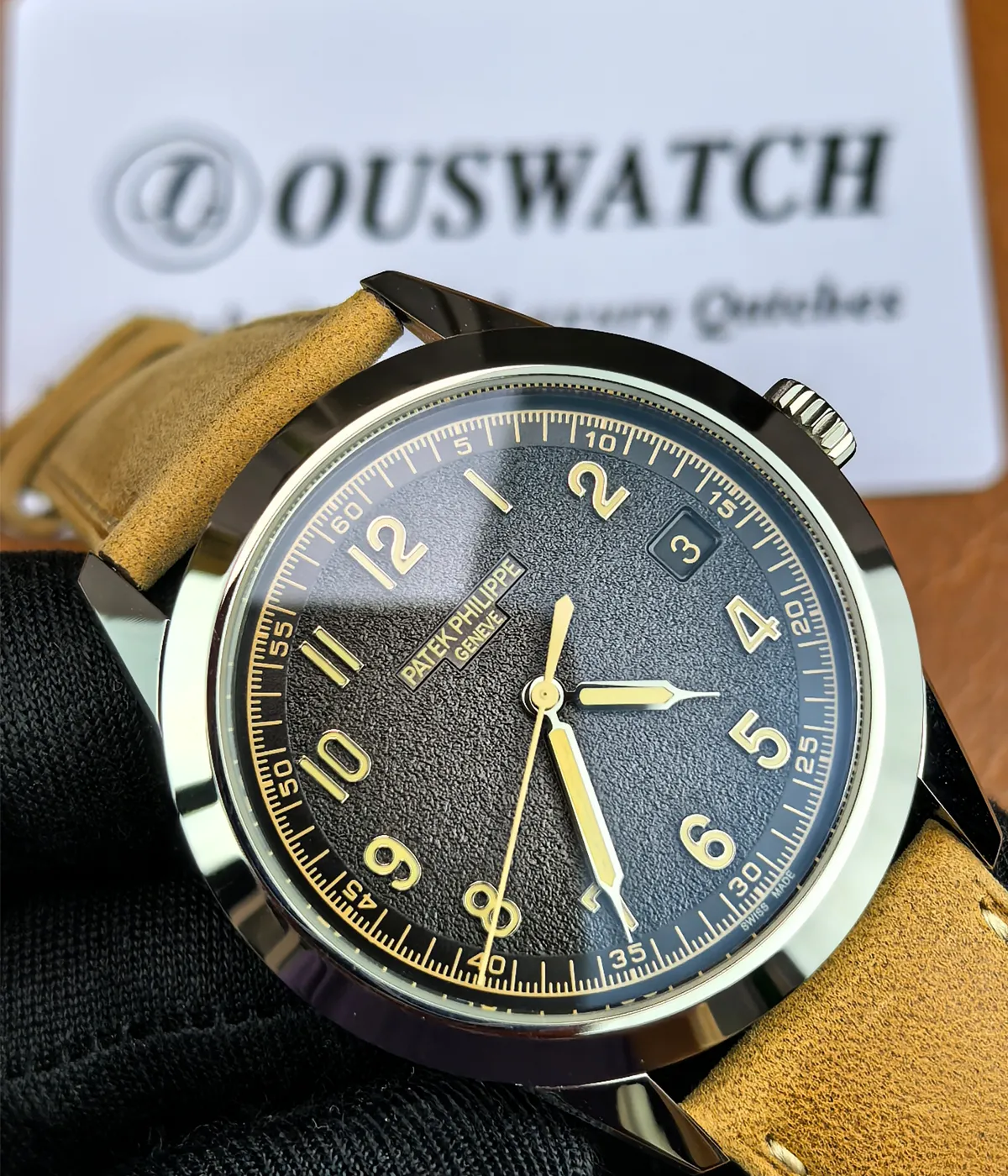 Close-up view of the front of the Patek Philippe 5226G-001 Calatrava, emphasizing the black dial and material details.