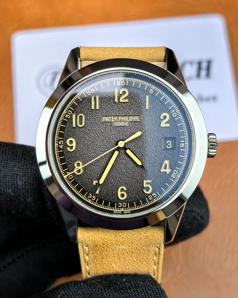 Front view of the Patek Philippe 5226G-001 Calatrava with a black dial and 18K white gold case.