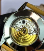 Detailed view of the movement inside the Patek Philippe 5226G-001 Calatrava, visible through the transparent caseback.