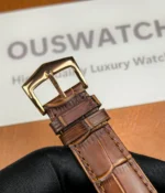 Front view of the buckle on the Patek Philippe 5227R-001 Calatrava Rose Gold strap, emphasizing the elegant clasp design.