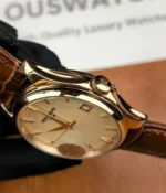 Close-up of the crown of the Patek Philippe 5227R-001 Calatrava Rose Gold, showcasing its detailed design and functionality.