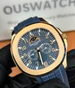 Close-up view of the dial and case of the Patek Philippe 5261R-001 Aquanaut Rose Gold, highlighting the blue-gray dial and polished rose gold case.