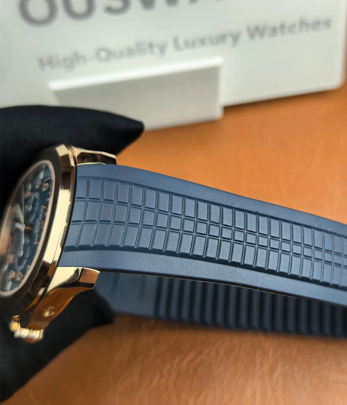 Detailed shot of the strap of the Patek Philippe 5261R-001 Aquanaut Rose Gold, highlighting the high-quality rubber material and comfortable fit.