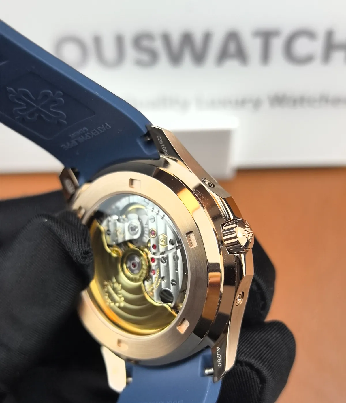 View of the transparent case back of the Patek Philippe 5261R-001 Aquanaut Rose Gold, providing a glimpse of the mechanical movement inside.