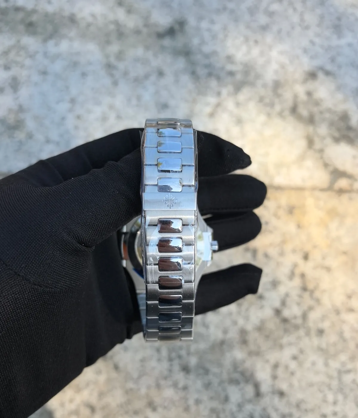 Close-up of the buckle on the Patek Philippe 5726/1A-014 Stainless Steel Blue Case 40mm, showcasing its elegant design and quality finish.