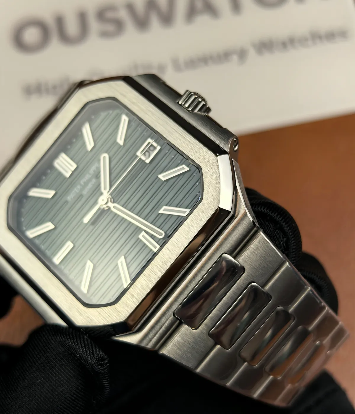 View of the case and bracelet of the Patek Philippe 5821/1A-001 men's watch with a green dial.