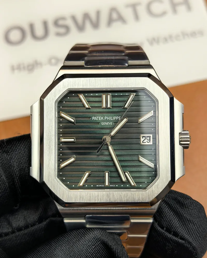 Front view of the Patek Philippe 5821/1A-001 men's watch with a green dial and steel strap.