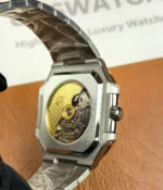 View of the transparent caseback showcasing the movement inside the Patek Philippe 5821/1A-001 men's watch.