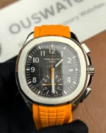 Front view of the Patek Philippe 5968A-001 Aquanaut with an orange strap and black dial.
