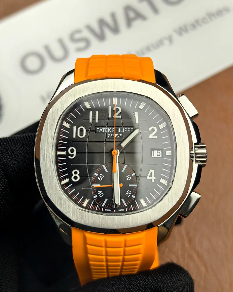 Front view of the Patek Philippe 5968A-001 Aquanaut with an orange strap and black dial.