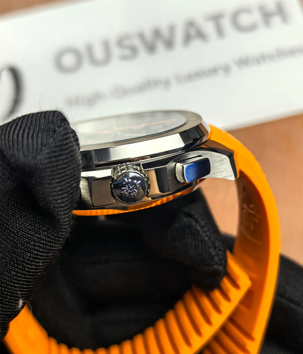 Right-side view of the Patek Philippe 5968A-001 Aquanaut with an orange strap.