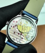 View of the transparent caseback of the Patek Philippe Calatrava 4897G-001 33mm watch, revealing the movement.