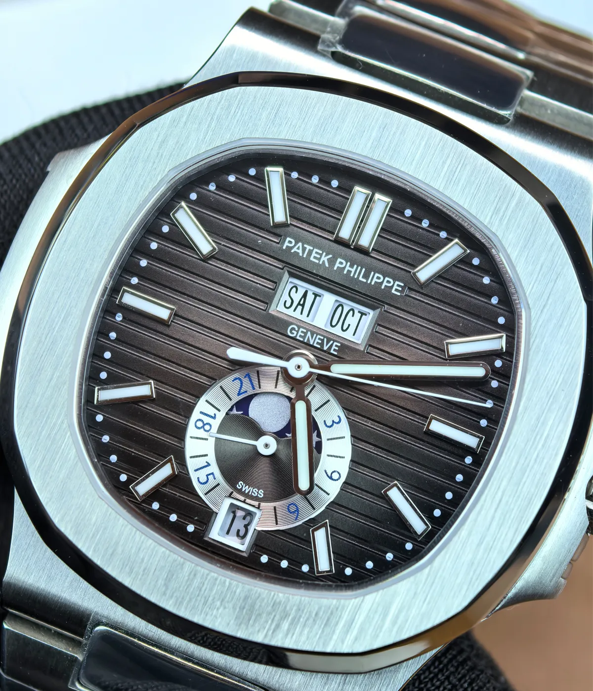 Detailed view of the dial and case of the Patek Philippe Nautilus 5726A-001 Moonphase Black Dial, emphasizing the moonphase complication and the refined case design.