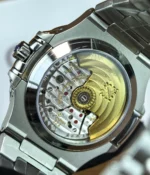 Detailed view of the mechanical movement inside the Patek Philippe Nautilus 5726A-001 Moonphase, showcasing the intricate Swiss craftsmanship and precision engineering.