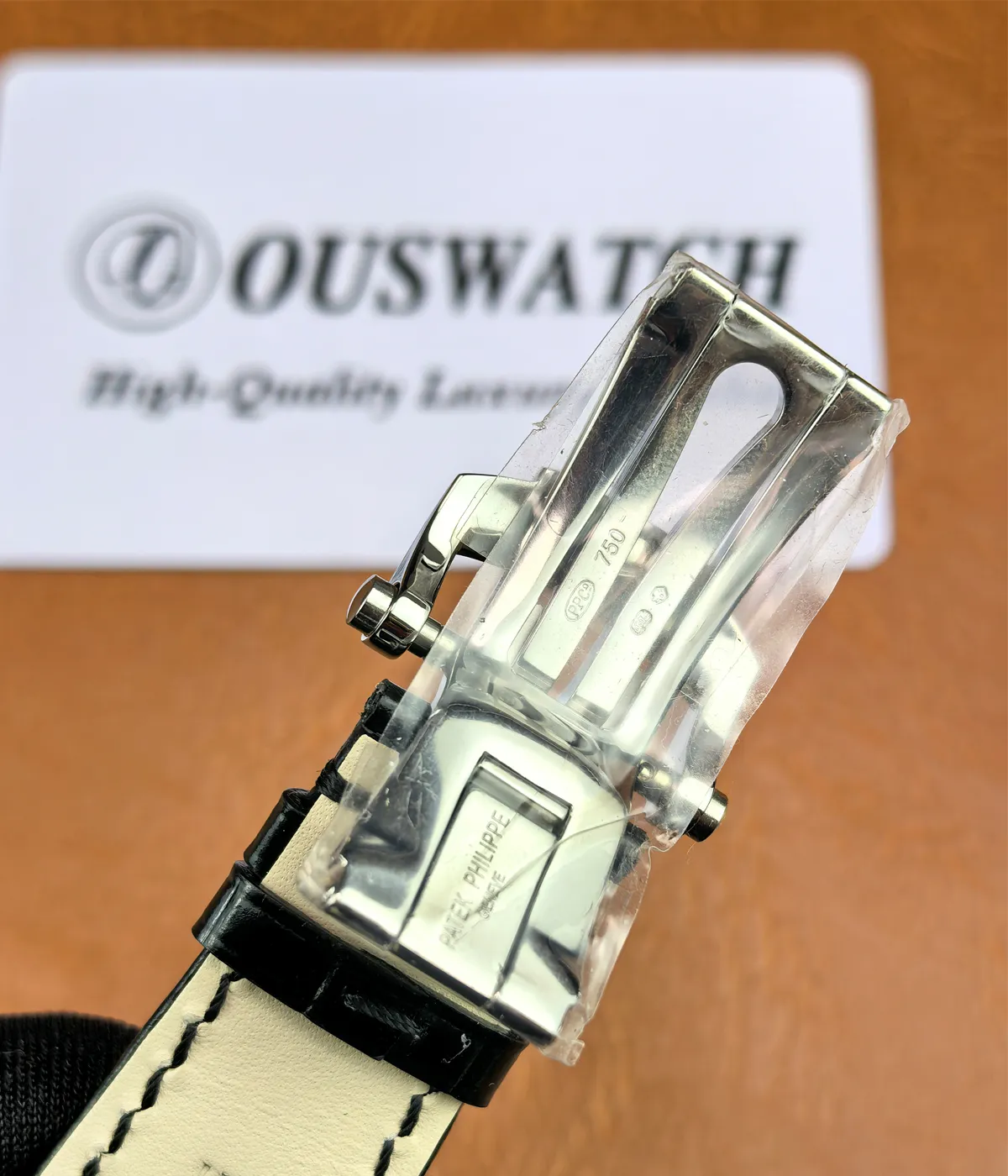 Detailed view of the clasp mechanism on the Patek Philippe Nautilus 5726a-001 Moonphase watch.