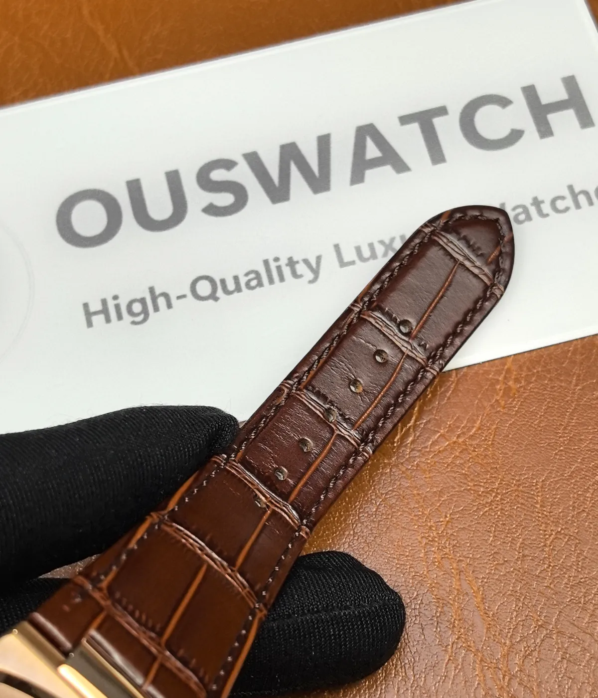 Full view of the leather strap on the Patek Philippe Nautilus 5980R-001 in rose gold.