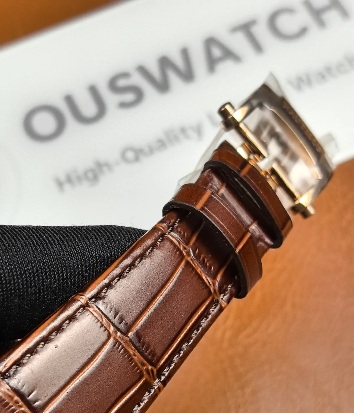 Full view of the leather strap on the Patek Philippe Nautilus 5980R-001 in rose gold.