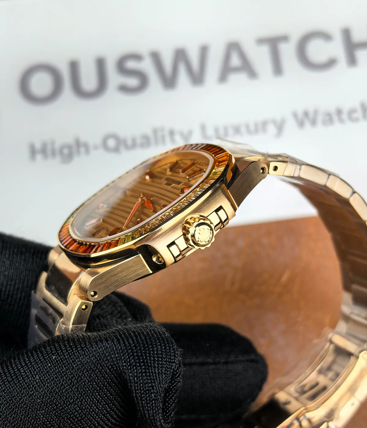 Close-up of the crown on the Patek Philippe Nautilus 7118-1300R-001 rose gold women’s watch.