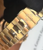 Detailed view of the buckle clasp on the Patek Philippe Nautilus Moonphase 5712-1R Rose Gold, highlighting the precision and luxury finish.