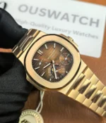 Close-up of the front dial and bracelet of the Patek Philippe Nautilus Moonphase 5712-1R Rose Gold, showcasing the detailed craftsmanship of the dial and the elegant bracelet.