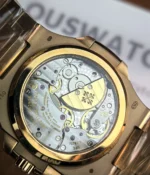 View of the mechanical movement inside the Patek Philippe Nautilus Moonphase 5712-1R Rose Gold, showcasing the exquisite craftsmanship and inner workings of the watch.