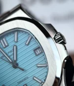 Close-up view of the crown on the Patek Philippe Nautilus Tiffany & Co Patek 5711 Blue Dial, emphasizing its sleek, functional design.