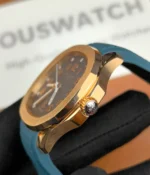 Close-up of the crown of the Patek Philippe Rose Gold Aquanaut 5269R-001, emphasizing the polished finish and elegant design.