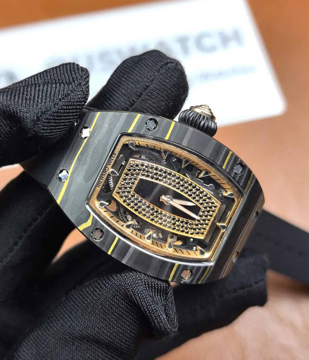 Close-up shot of the front of the Richard Mille RM07-01 watch, highlighting the materials and fine craftsmanship.