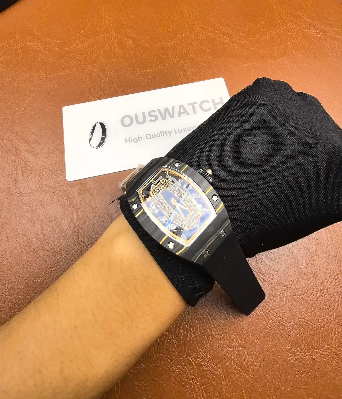 The Richard Mille RM07-01 Quartz Tpt black dial automatic watch worn on the wrist, demonstrating its fit and elegance.