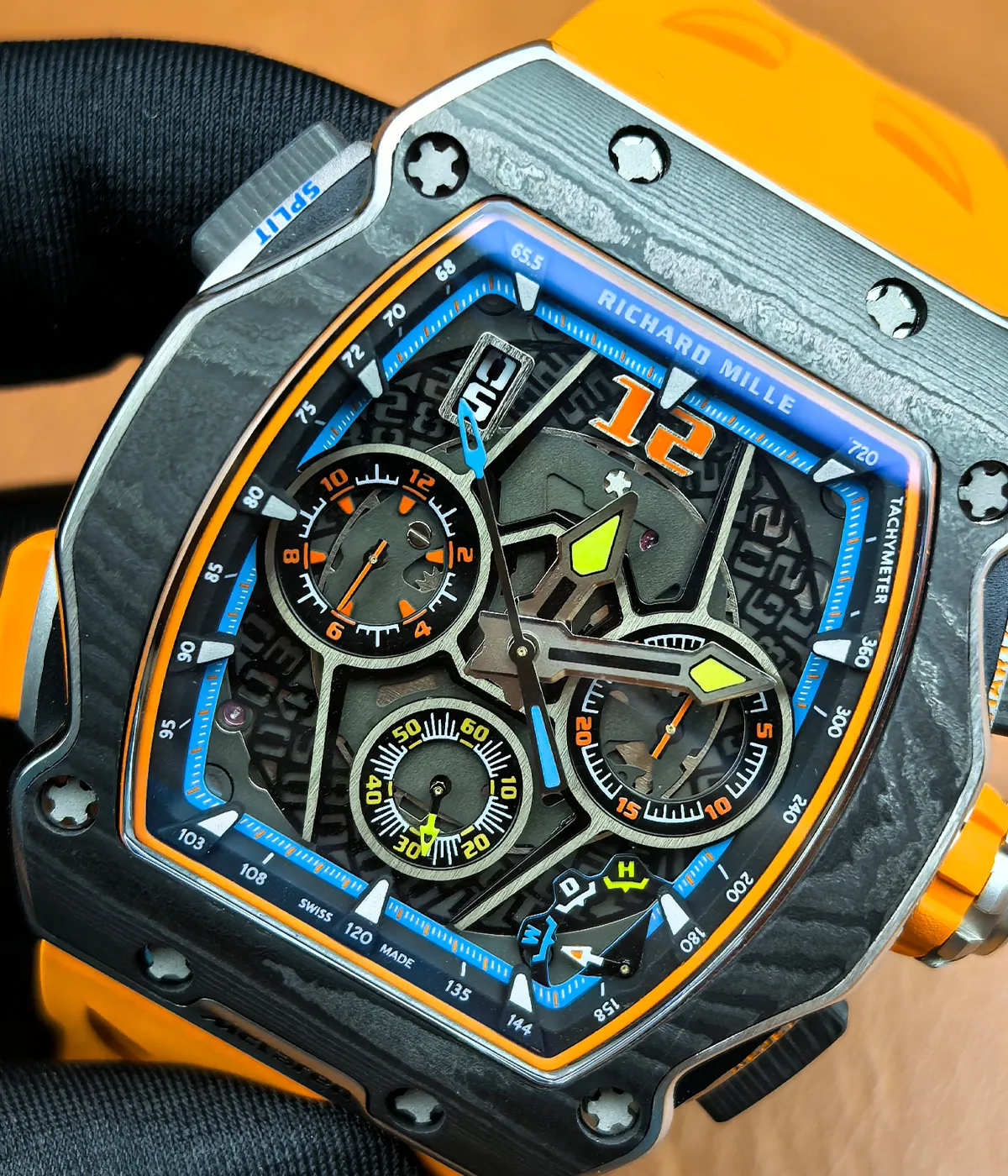 Close-up of the watch front highlighting dial texture, markers, and material finish.