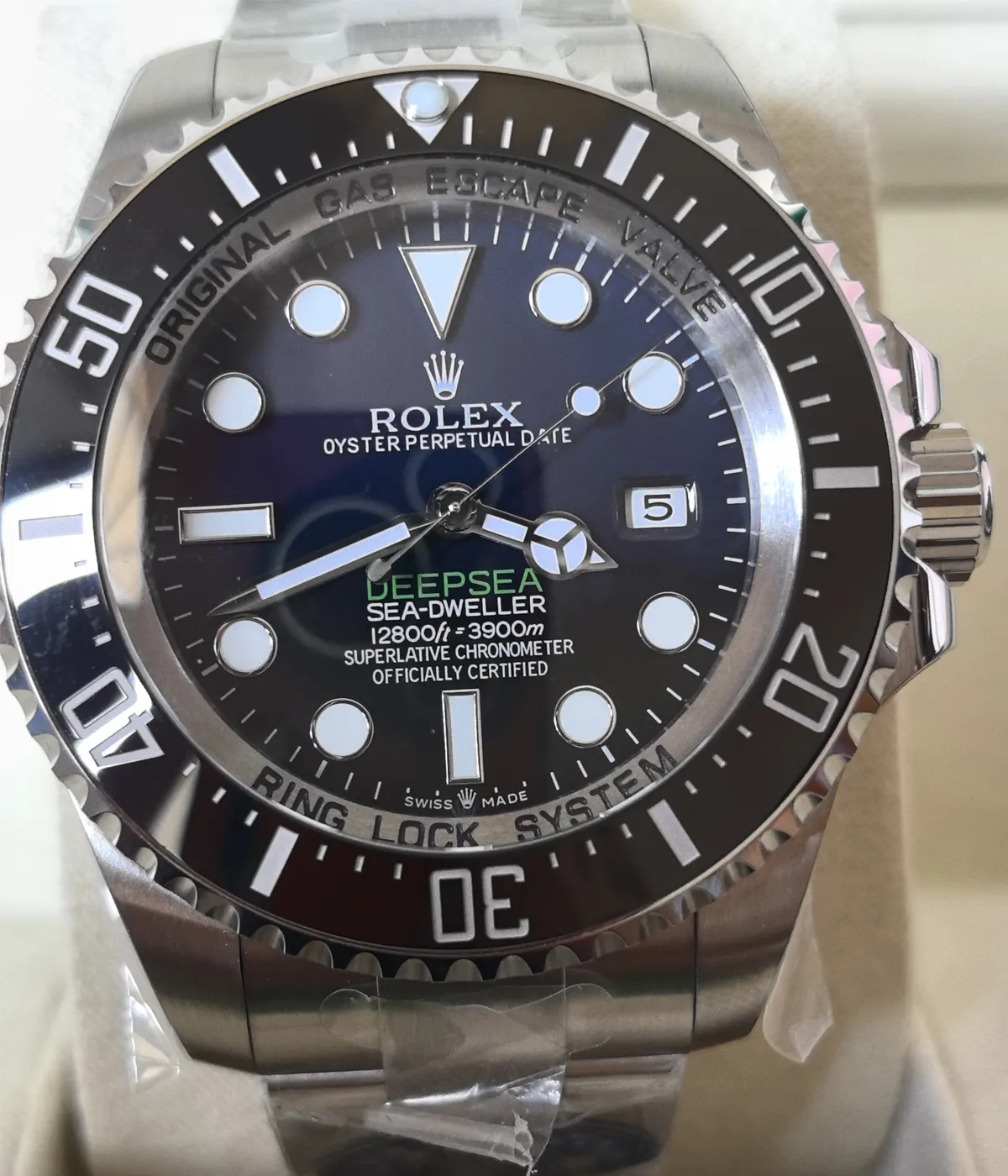 Detailed view of the dial and bezel on the Rolex 44MM D-Blue Dial M136660-0005 with a black ceramic bezel and Oyster strap.