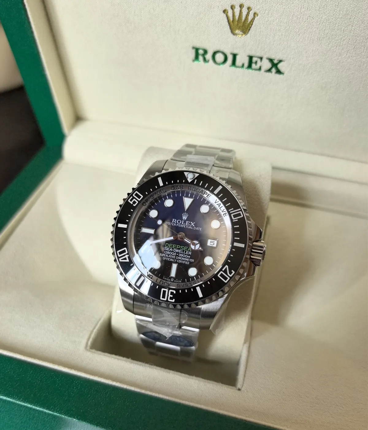 View of the packaging for the Rolex 44MM D-Blue Dial M136660-0005 with a black ceramic bezel and Oyster strap.